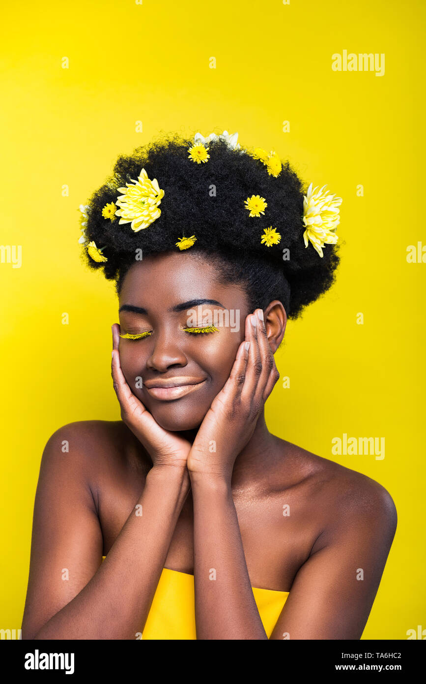 Relaxed African American Girl With Chrysanthemums In Hair With