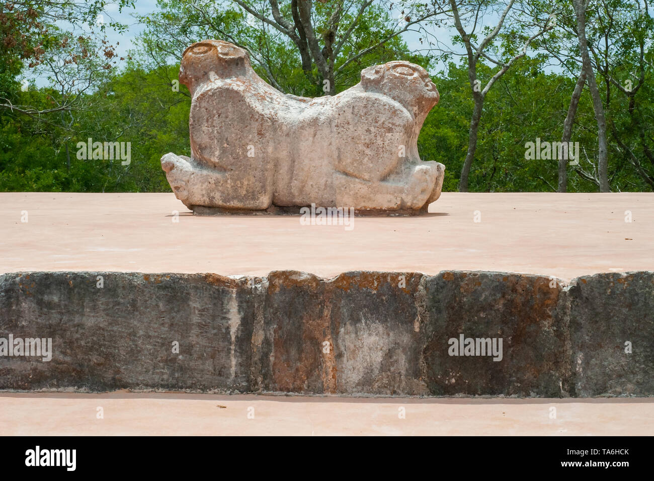 Ancient Mayan statue, which symbolizes a jaguar with two heads, in the archaeological area of Uxmal, in the Yucatan peninsula Stock Photo