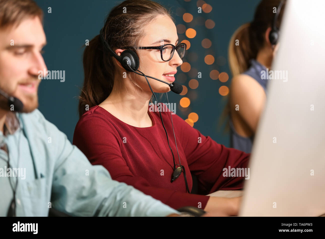 Technical support agents working in office Stock Photo - Alamy