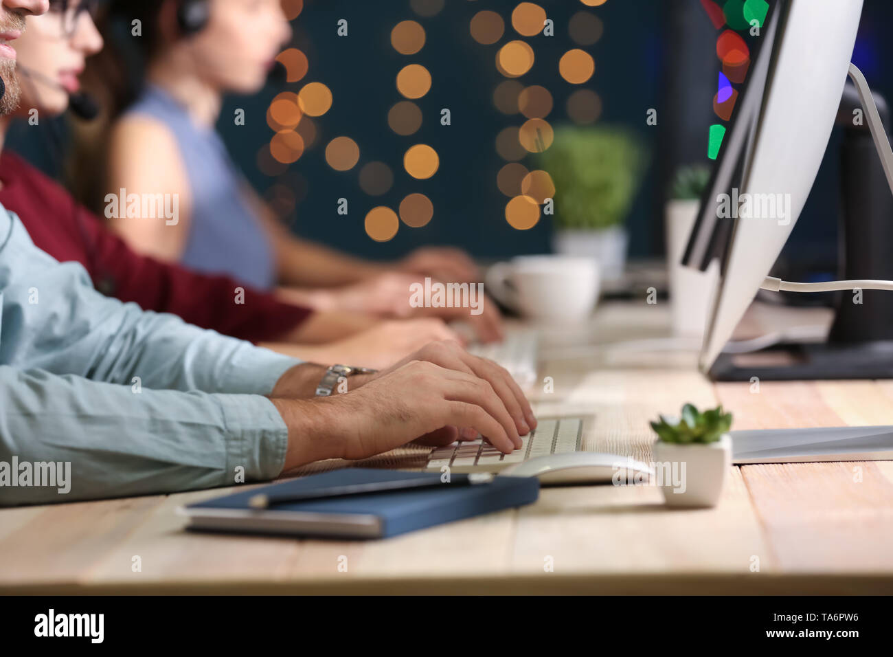 Technical support agents working in office Stock Photo - Alamy