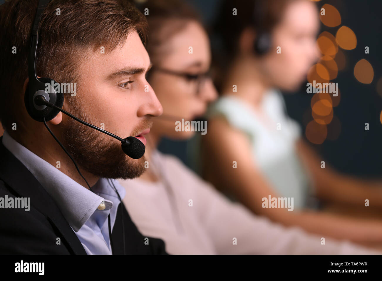 Male technical support agent working in office Stock Photo - Alamy