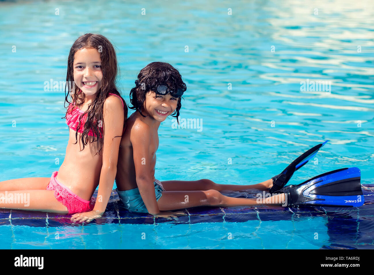 little boy in girl swimsuit