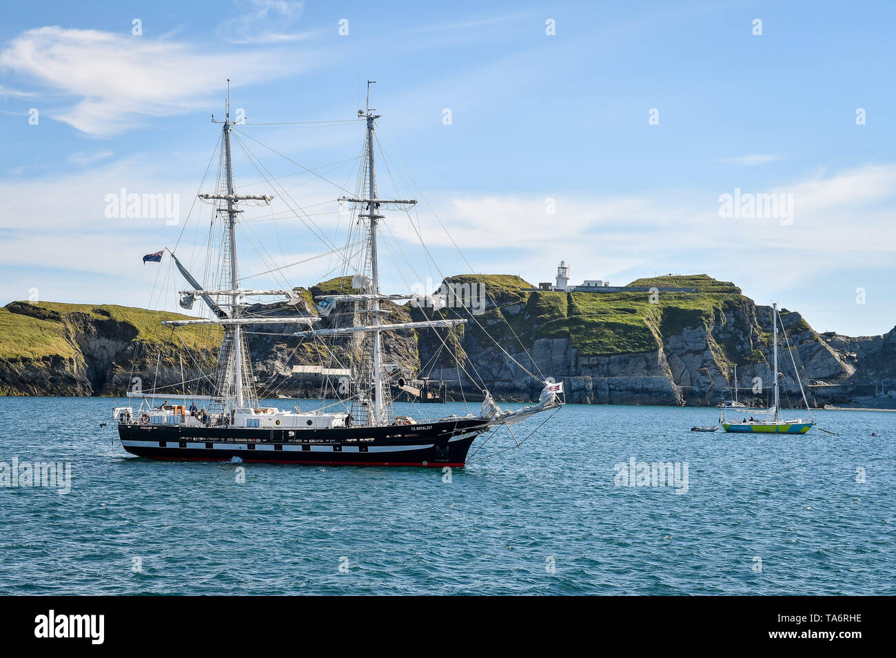 The Sea Cadets flagship TS ROYALIST sits anchored off the shore of Lundy Island in the Bristol Channel, where the training brig is on a six day voyage carrying over 20 cadets to sea around parts of the UK coast. Stock Photo