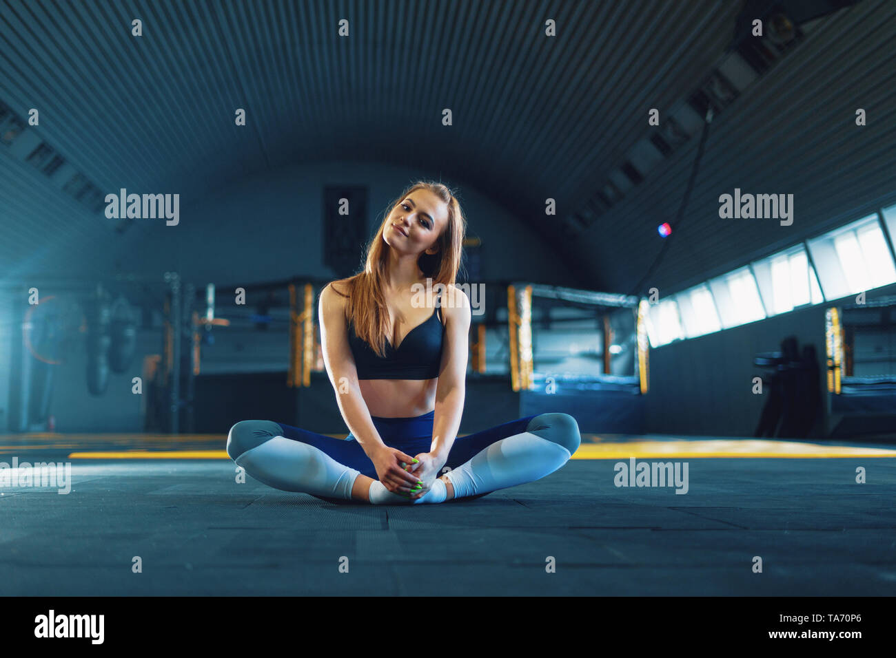 Young Indian girl doing Yoga . Surya Namaskar with mountain