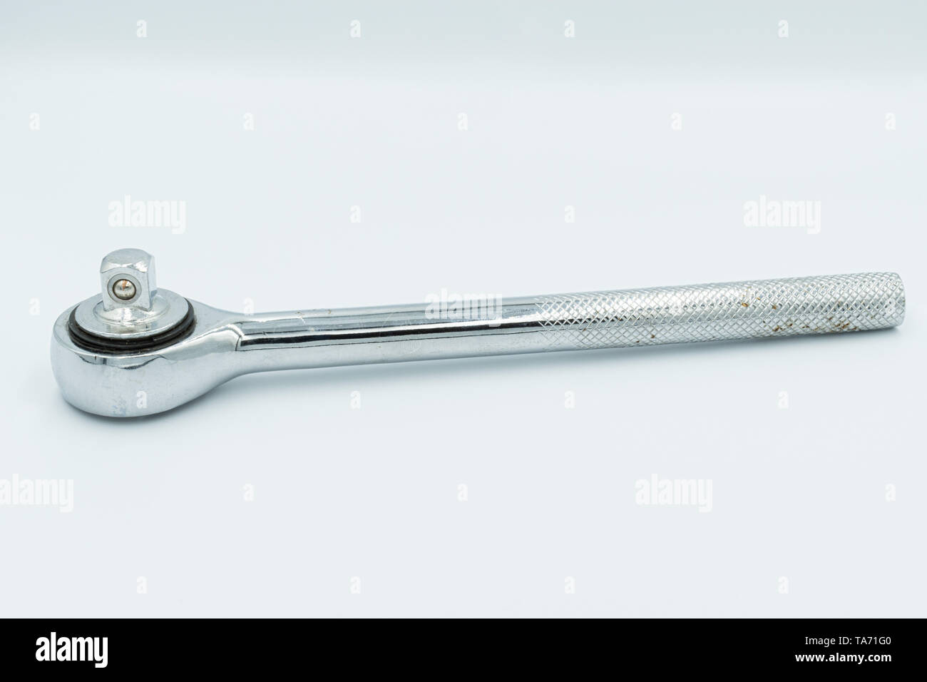 This capture of a silver socket wrench on a white background and in a studio light Stock Photo