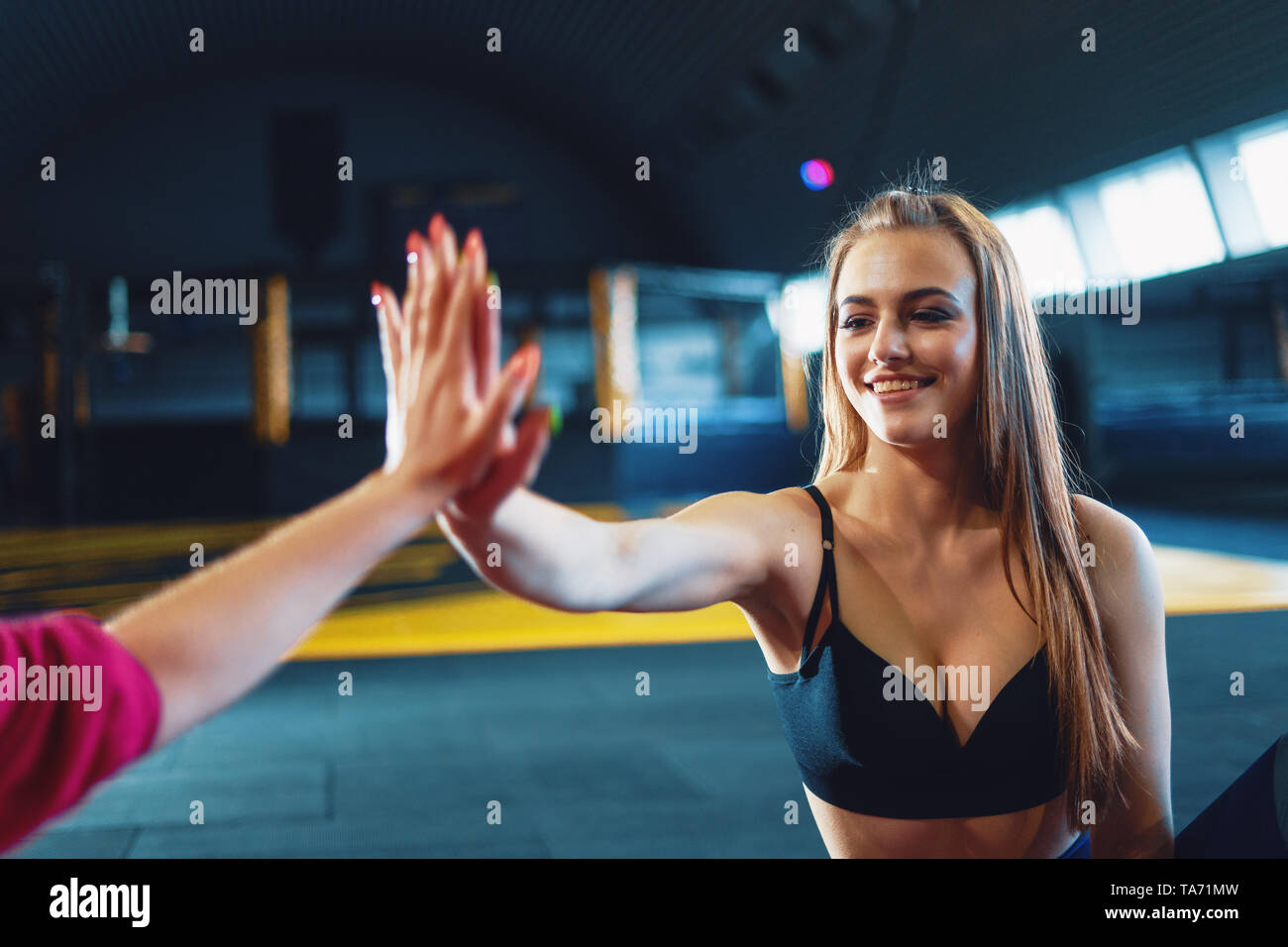 Two Young Women Giving High Five High Resolution Stock Photography and ...