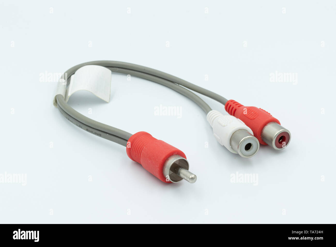 This is a capture for a red and white RCA cable on a white background and a studio light Stock