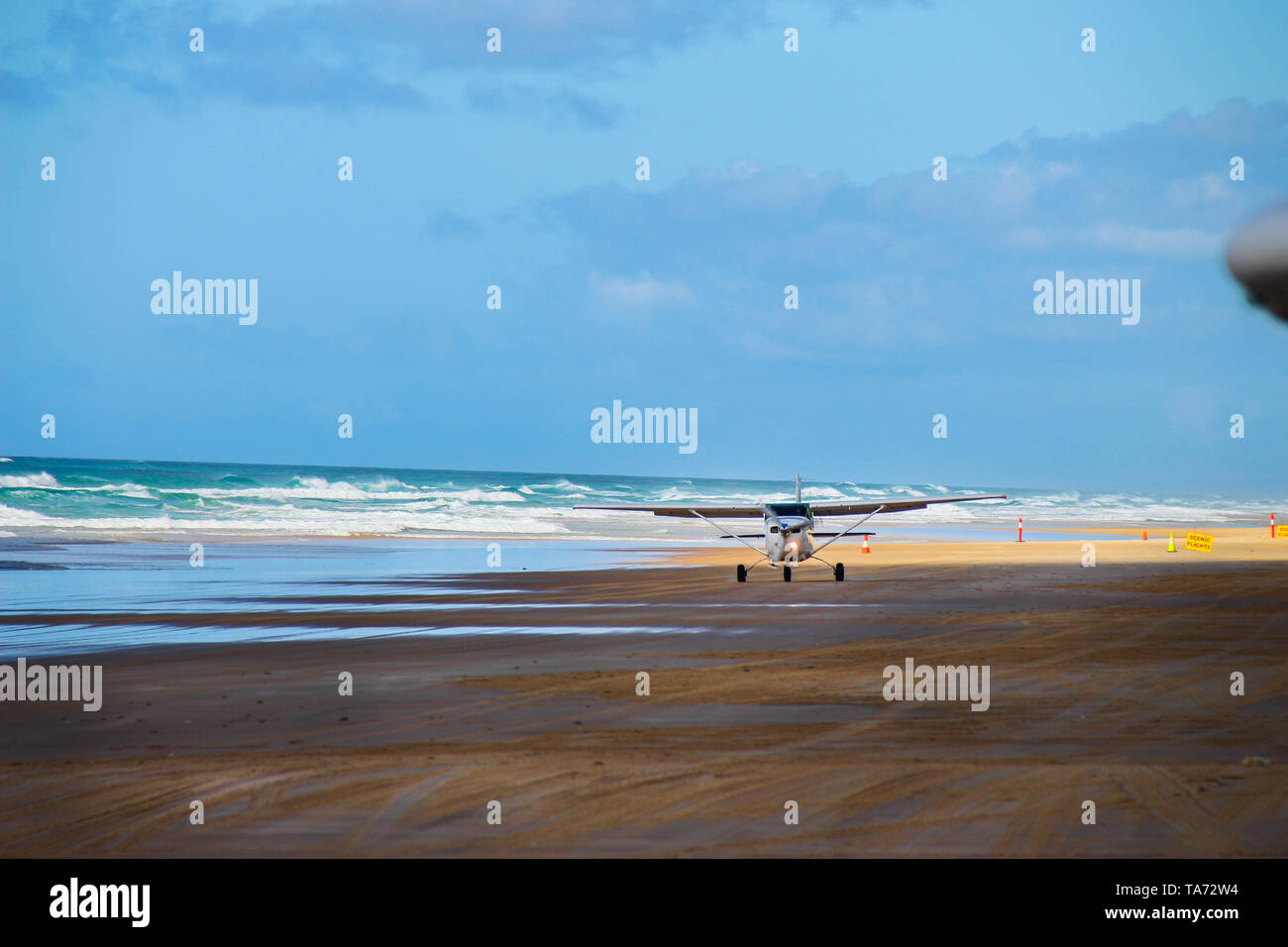 Plane Taking Off At 75 Mile Beach On Fraser Island, Australia Stock Photo