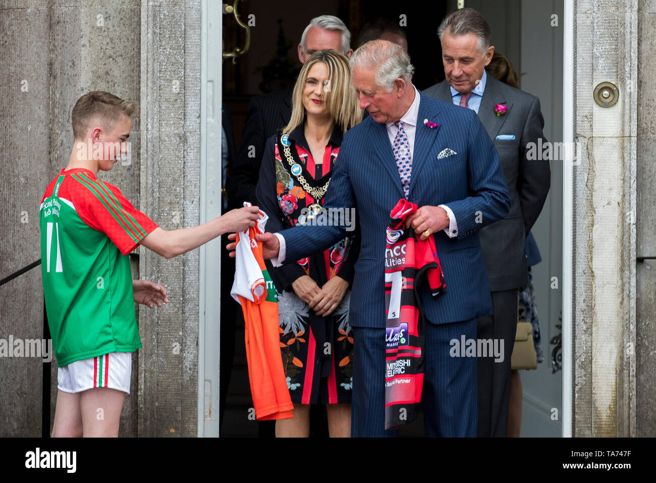 the-prince-of-wales-is-presented-with-an-armagh-gaa-county-jersey-by-st-patricks-grammar-school-armagh-pupil-ryan-mcalary-following-an-engagement-at-palace-demense-in-co-armagh-TA747F.jpg