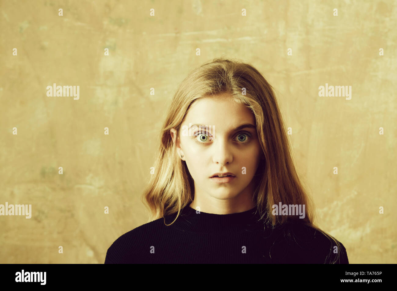 girl or surprised beautiful young woman on wall background Stock Photo ...