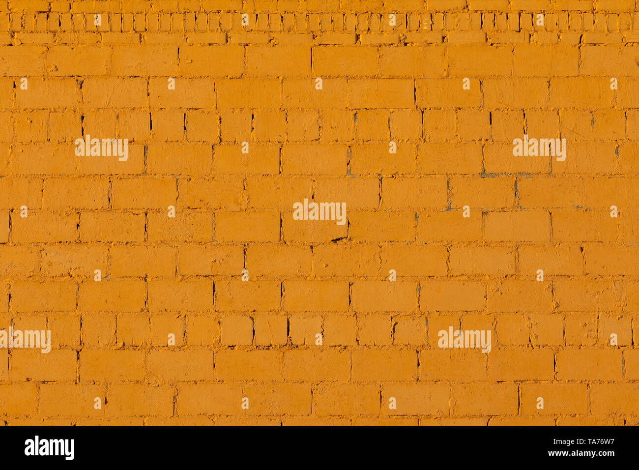 orange plaster rough brick outside wall texture Stock Photo