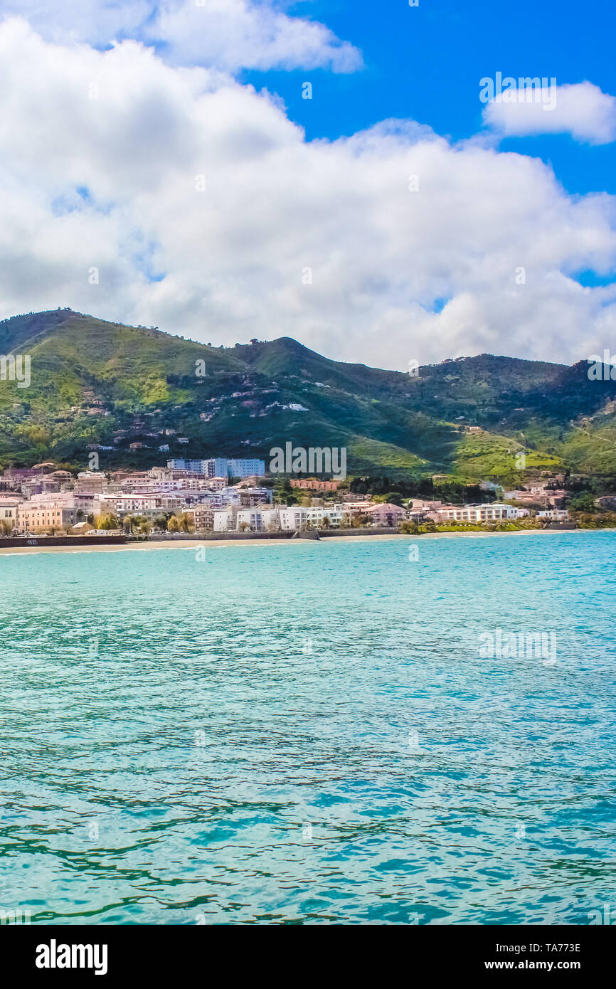 Amazing seascape in Italian Cefalu, Sicily. The beautiful Sicilian city on the Tyrrhenian coast is surrounded by rocky hills. The town is a popular summer vacation spot. Stock Photo