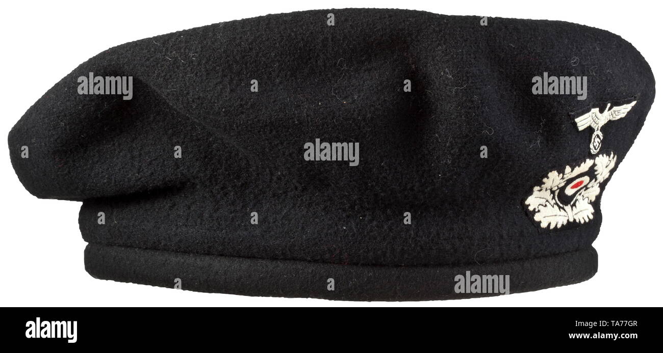 A protective Panzer beret complete with removable cover Padded body with black felt finishing coat, six large rubber ventilation rivets, six-section black oil cloth with brown leather sweatband (small blemishes). Black knitted cover in the shape of a beret with the early, white-woven emblems on a black base. historic, historical, army, armies, armed forces, military, militaria, object, objects, stills, clipping, clippings, cut out, cut-out, cut-outs, 20th century, Editorial-Use-Only Stock Photo