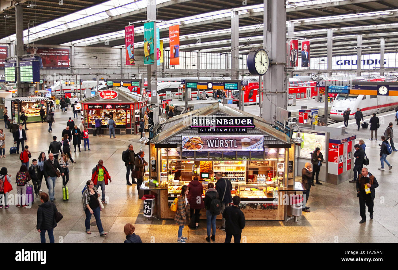 MUNICH, GERMANY -  Munich central station departure and arrival hall with food kiosks Stock Photo