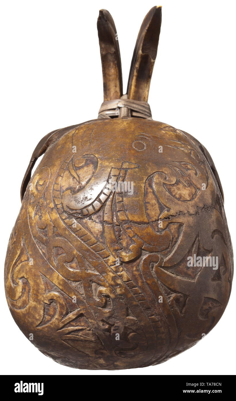 A Dayak trophy skull, Borneo Elaborately carved skull, the entire