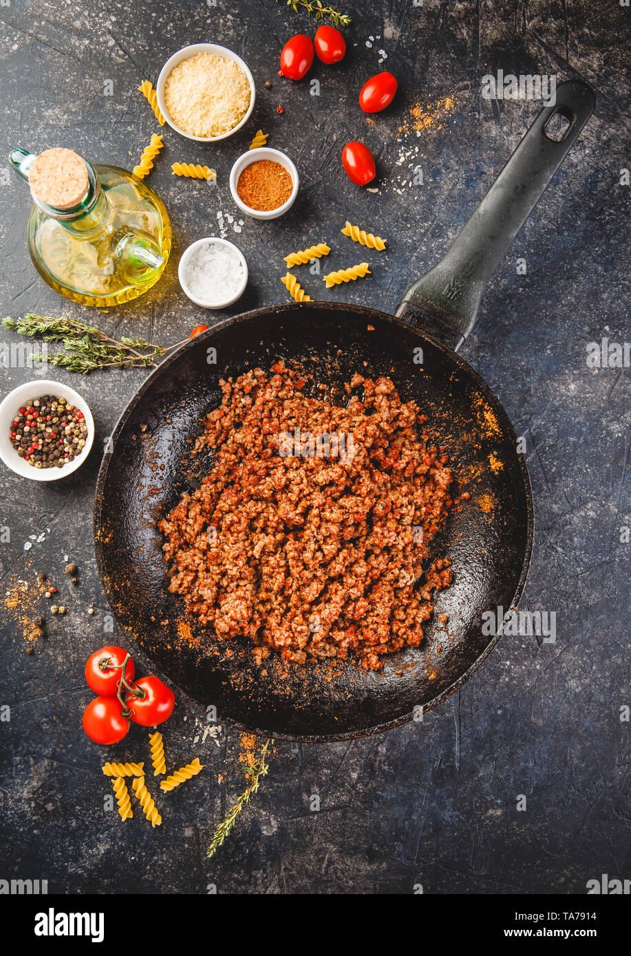 Roasted minced beef in pan and ingredients for classic Italian