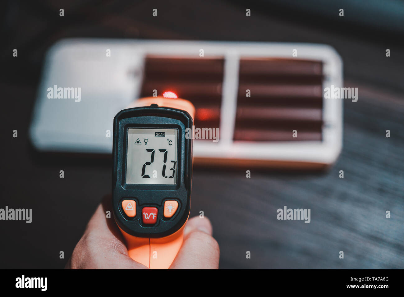 Measuring temperature of charging lithium ion battery pack showing that the temperature rising