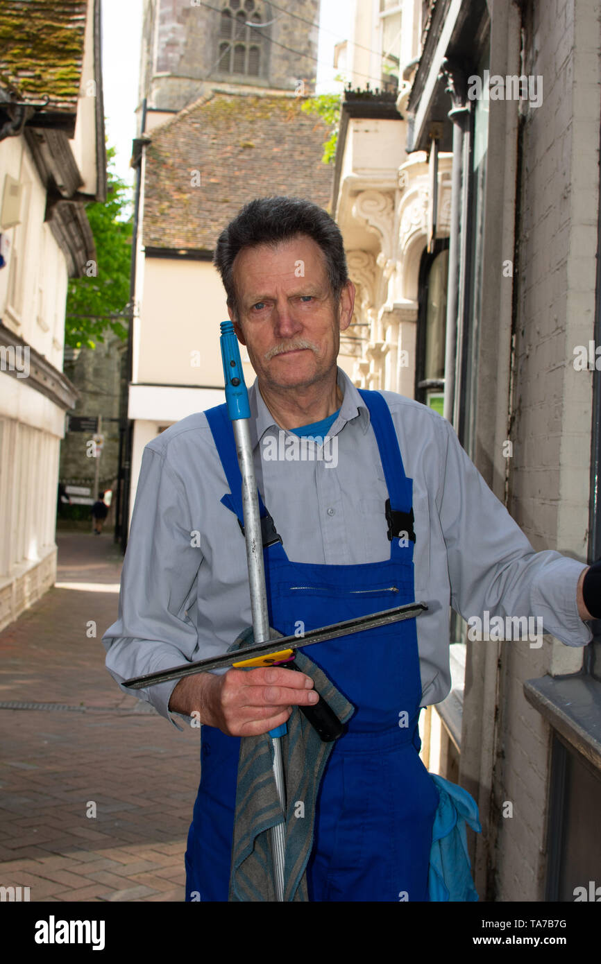 Window Cleaner at the Ashford Highstreet Stock Photo