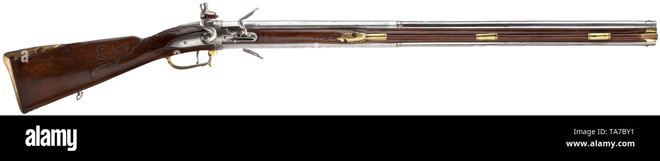 A flintlock turn-over gun by Andreas Ertel, Dresden, circa 1760 Two-stage barrels, octagonal breech section turning into round with smooth bores in 15 mm calibre. Above the breeches silver-inlaid signature 'Andreas Erttel' as well as numbering '1' and 'in Dresden' and number '2' respectively. Lightly engraved frizzens and lock. Trigger guard with sprung front edge acting as the barrel-release. Figured walnut full stock with smooth brass furniture. Wooden ramrod with horn tip retained by three pipes at the side. Length 116 cm. Andreas Ertel (1689 , Additional-Rights-Clearance-Info-Not-Available Stock Photo