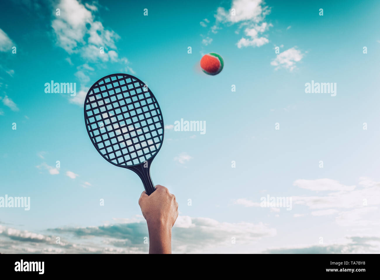 Summer game of badminton or beach tennis against the sky. Concept summer games Stock Photo
