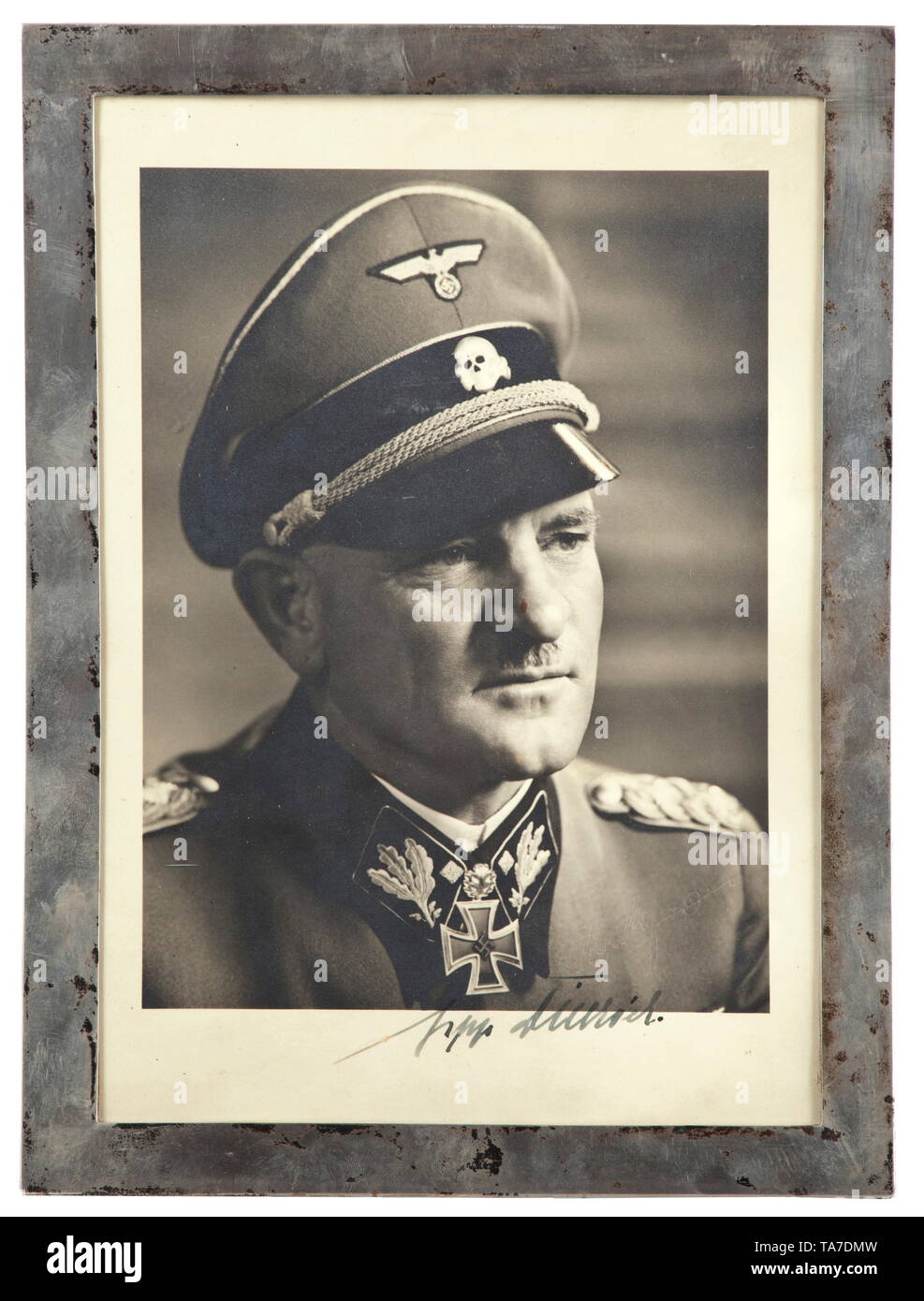 Sepp Dietrich (1892 - 1966) - leader of the 'Leibstandarte' - a silver-framed photograph with dedication Portrait photograph with original signature in ink, the photograph with studio stamp. In a silver standing frame with several marks. Dimensions of frame 24 x 32 cm. Rare. historic, historical, 20th century, 1930s, 1940s, Waffen-SS, armed division of the SS, armed service, armed services, NS, National Socialism, Nazism, Third Reich, German Reich, Germany, military, militaria, utensil, piece of equipment, utensils, object, objects, stills, clipping, clippings, cut out, cut, Editorial-Use-Only Stock Photo