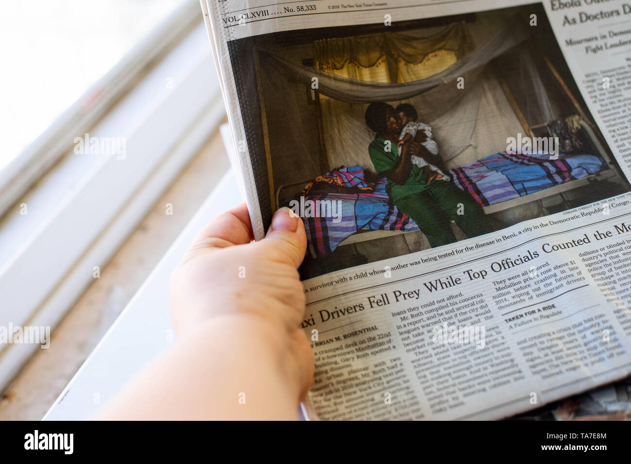 A Stack Of Newspapers The New York Times And Usa Today Lay On A