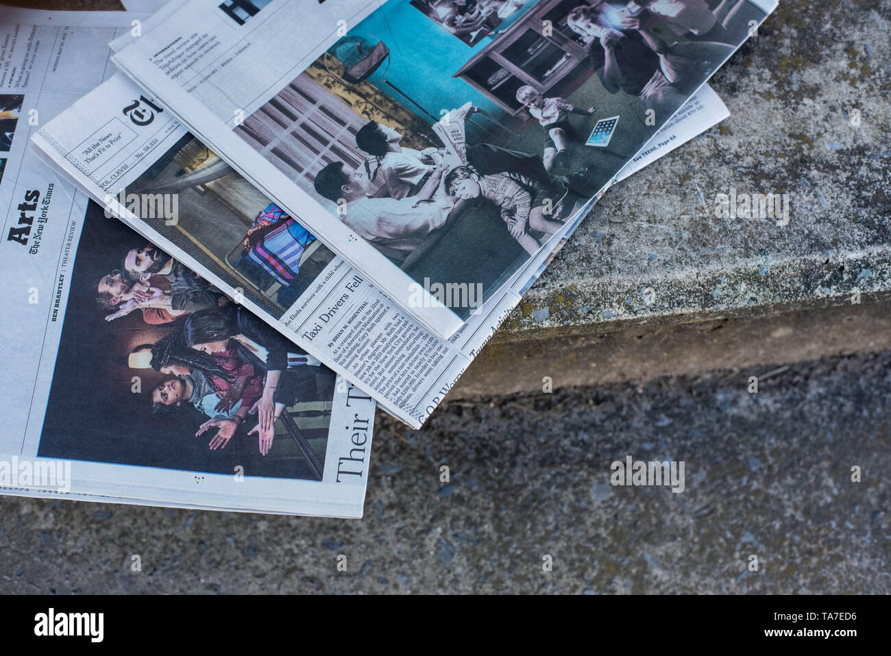 A Stack Of Newspapers The New York Times And Usa Today Lay On A