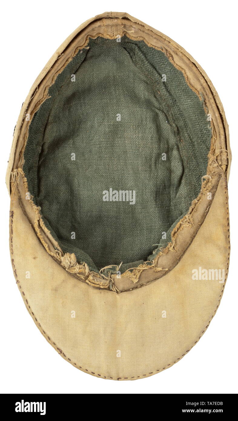 A tropical field cap M 41 for Waffen-SS mountain troops enlisted men/NCOs frontline-manufactured, circa 1943 Made of sand-coloured linen, cap button made from grey varnished synthetic resin, BeVo-woven insignia (sand-coloured on black base, no edelweiss), green linen herringbone lining, sweatband missing. Heavily used cap. historic, historical, 20th century, Editorial-Use-Only Stock Photo