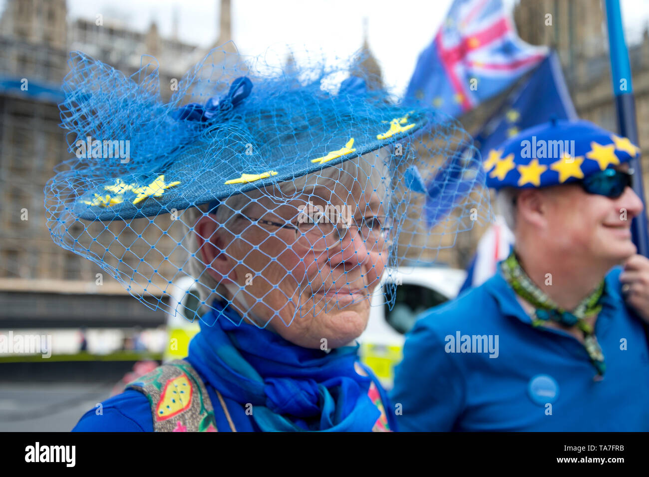 Westminster. Opposite Houses of Parliament May 22nd 2019. Protest to stop Brexit by Remainers. A man and a woman are dressed in blue with blue hats wi Stock Photo