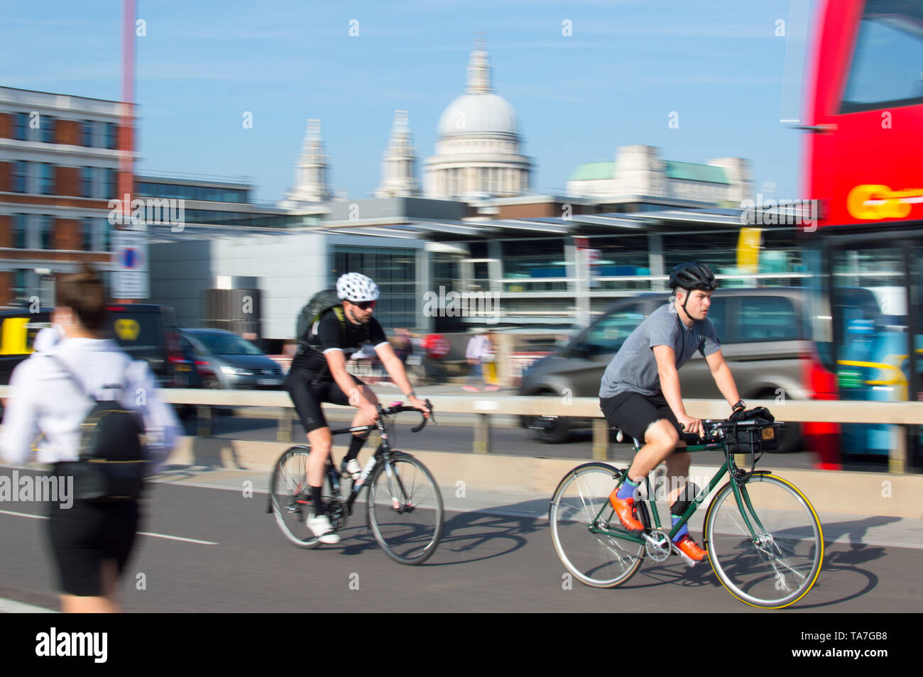 London city cyclist (Motion Blur) in City with St.Pauls at background Stock Photo