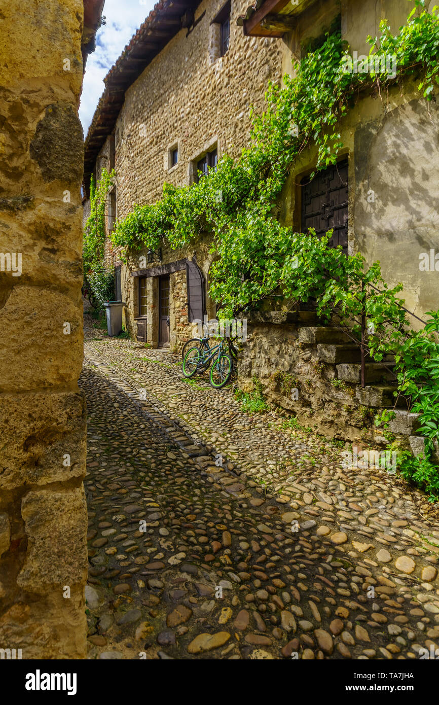 View of an alley in the medieval village Perouges, Ain department ...