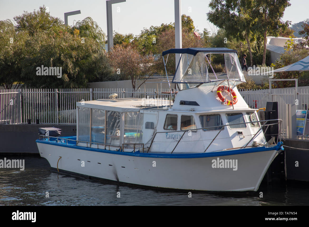 Small fishing boat moored in the harbour of Swan River, Perth, Western Australia. Stock Photo