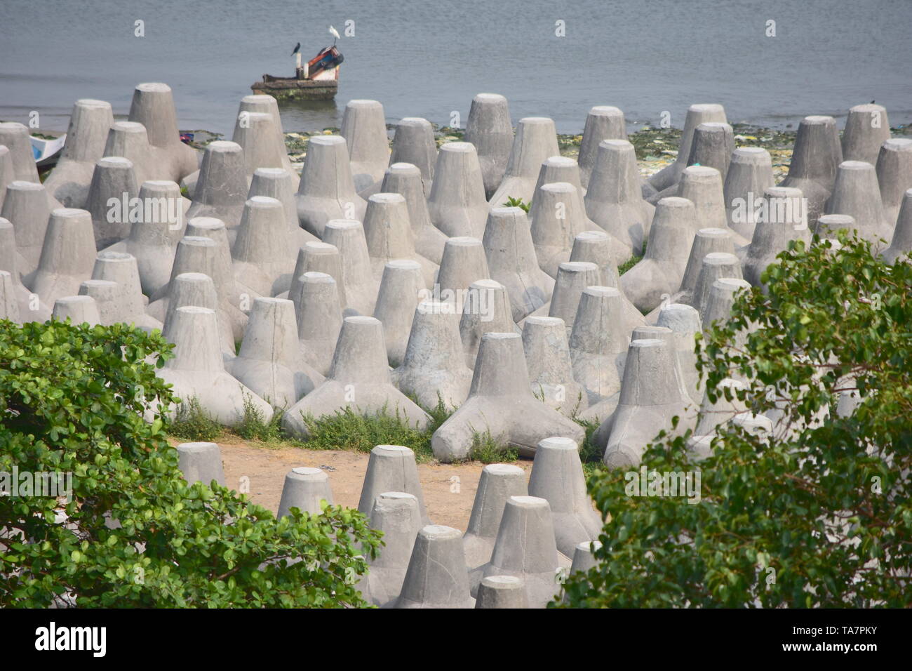 Kollam, Kerala, India: March 2, 2019 - Tangasseri Lighthouse and Fishing Harbour Stock Photo