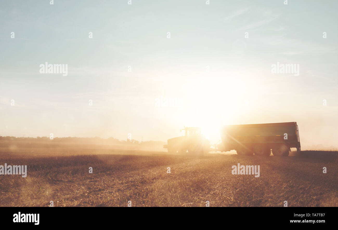 Harvest tractor field hi-res stock photography and images - Alamy