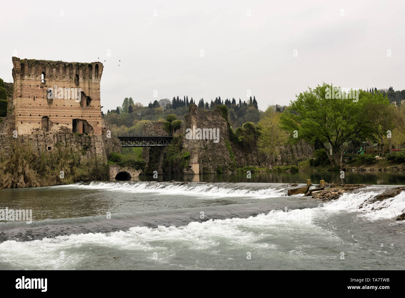 Medieval tower with bridge on Mincio river Stock Photo