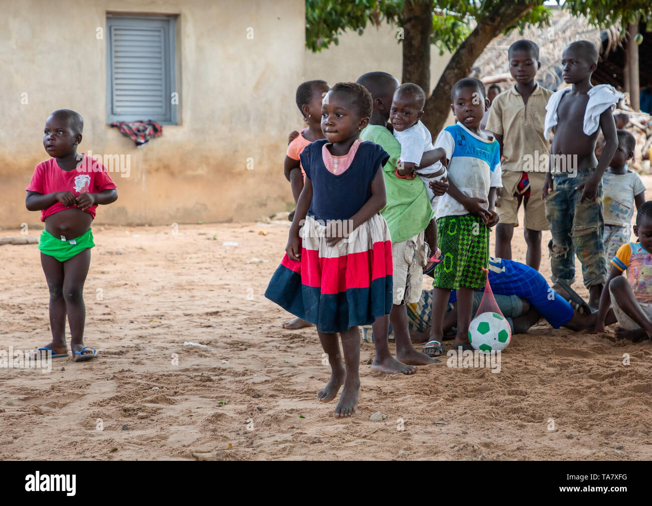 Children in the courtyard of a village, Région des Lacs, Bomizanbo, Ivory Coast Stock Photo
