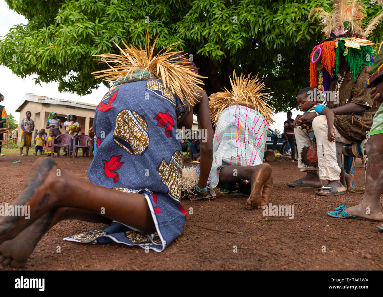 Young Senufo shirtless women dancing the Ngoro during a ceremony, Savanes district, Ndara, Ivory Coast Stock Photo