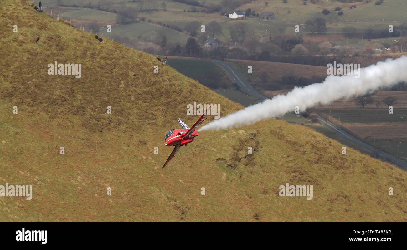 RAF Red Arrows Hawk T1 flying low level in the Mach Loop in Wales, UK Stock Photo