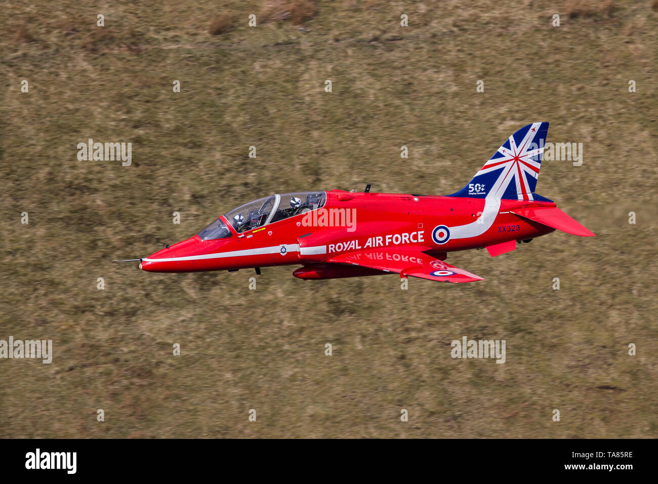 RAF Red Arrows Hawk T1 flying low level in the Mach Loop in Wales, UK Stock Photo