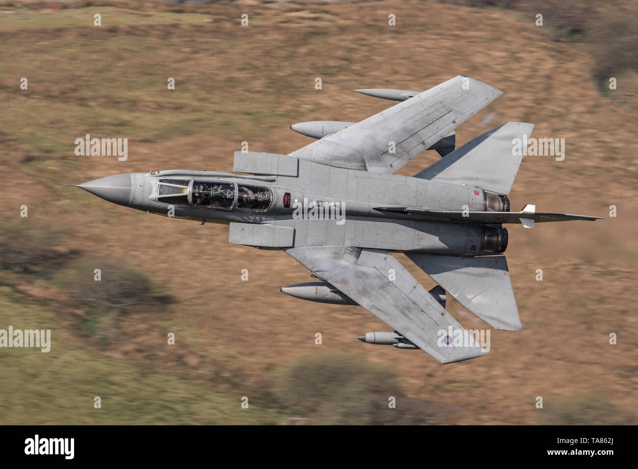 RAF Panavia Tornado GR4 jet flying low level through the Mach Loop, Wales, UK Stock Photo
