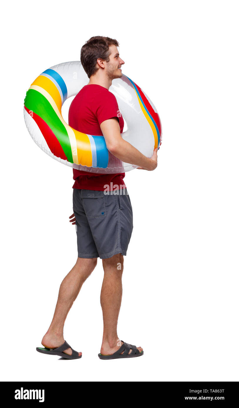 Side view of man with a beach bag that goes to side. backside view of person. Rear view people collection. Isolated over white background. The guy wal Stock Photo Alamy