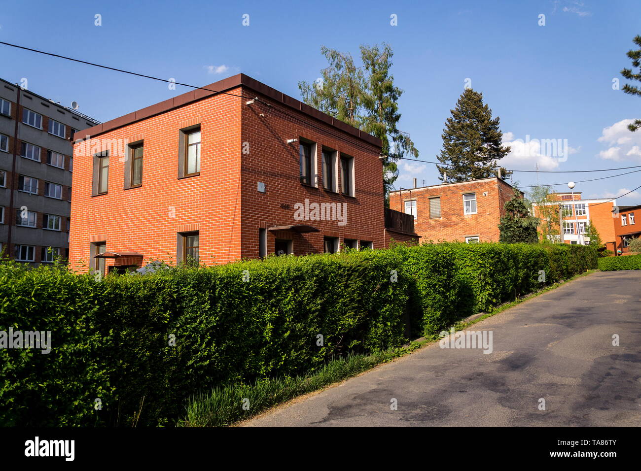 Typified red brick family Bata houses in Zlin, Moravia, Czech Republic, sunny summer day, street view Stock Photo