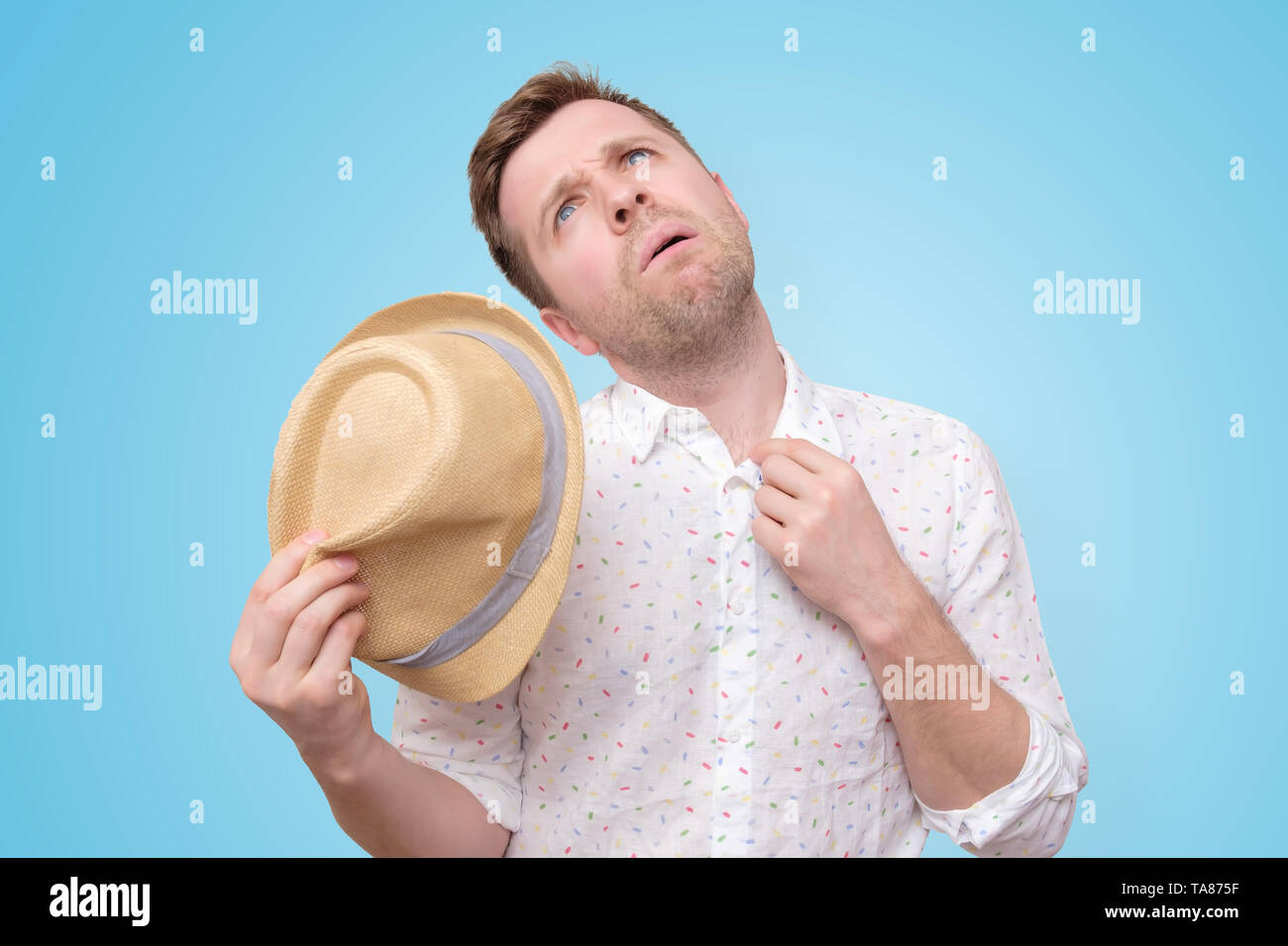 Man is worried and tired because of sweating stain Stock Photo