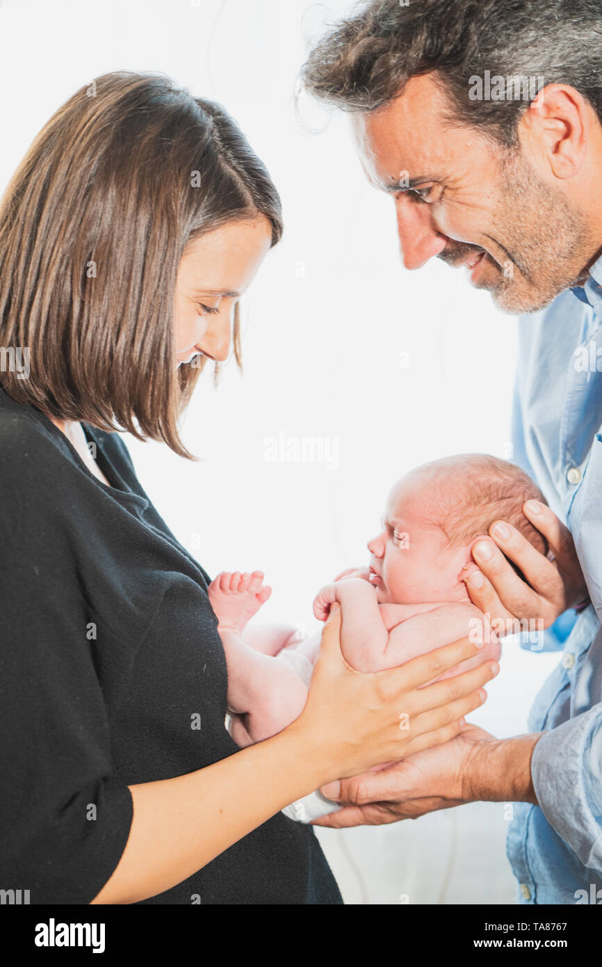 Baby Newborn Sleeping on Parents Hands, New Born Kid Sleep in Family