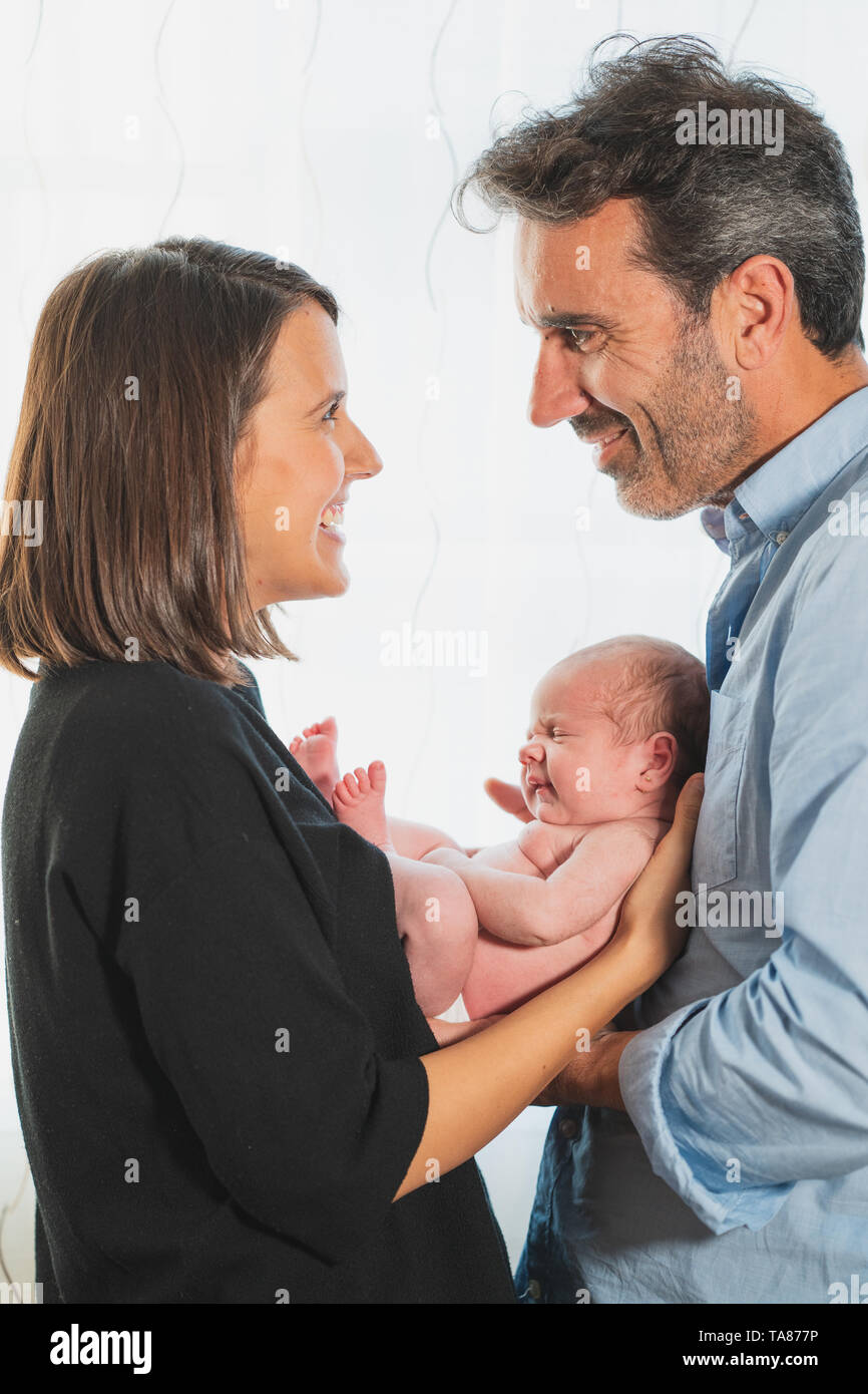 Baby Newborn Sleeping on Parents Hands, New Born Kid Sleep in Family