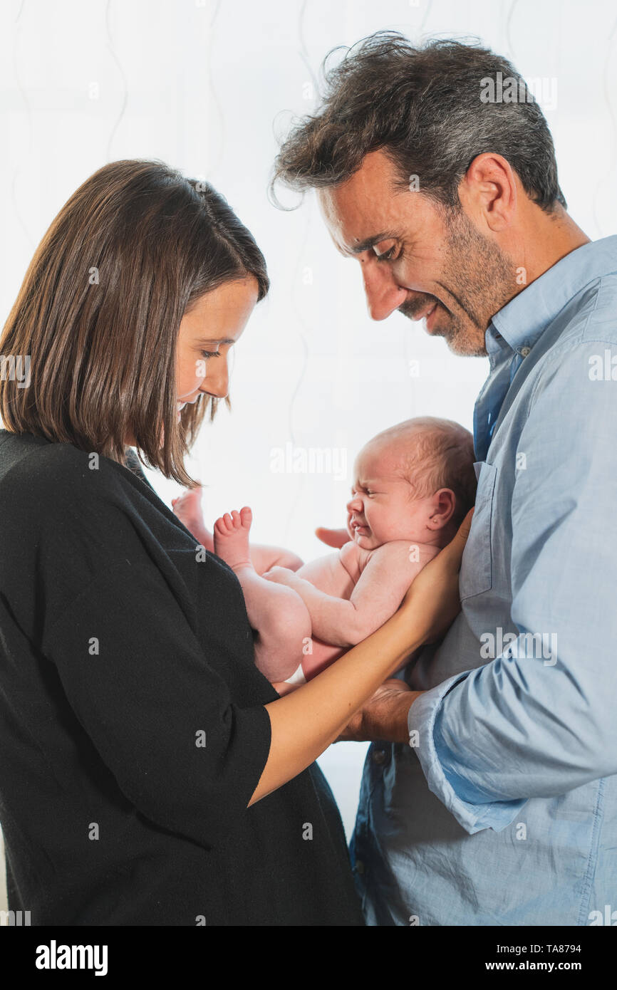 Baby Newborn Sleeping on Parents Hands, New Born Kid Sleep in Family