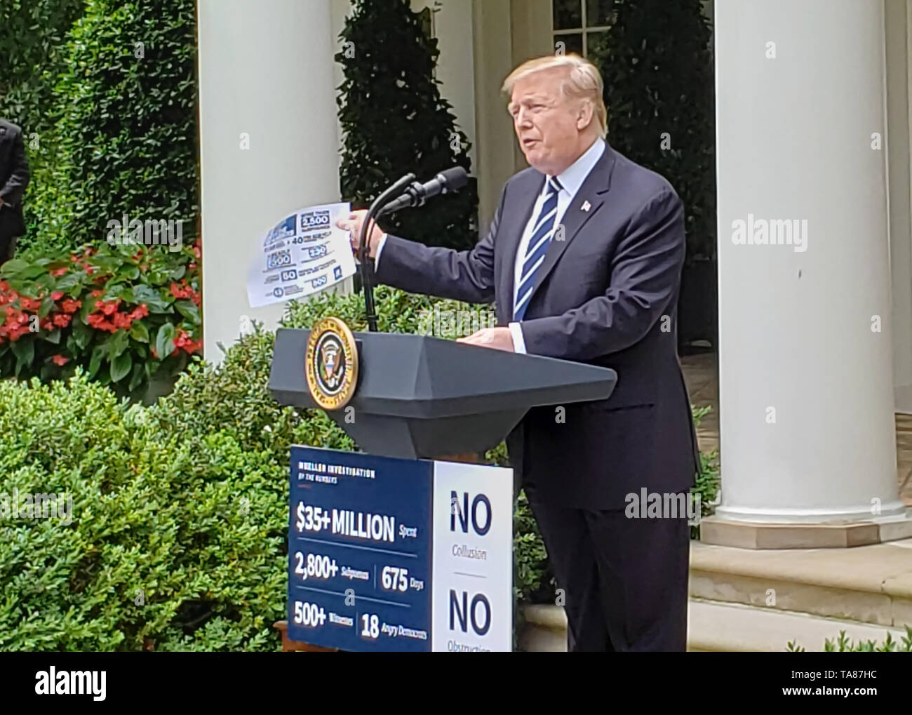 Washington DC, May 22,2019, USA: President Trump holds up a paper outlimg what he says is the finances spent on the Mueller report which he considers  Stock Photo