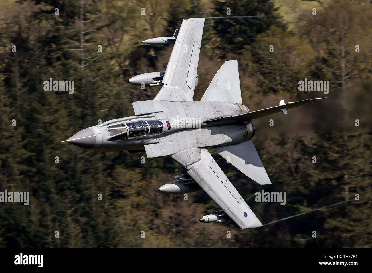 RAF Panavia Tornado GR4 jet flying low level through the Mach Loop, Wales, UK Stock Photo