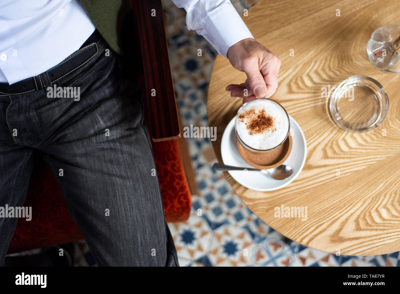 Man having a cup of coffee in the bar Stock Photo