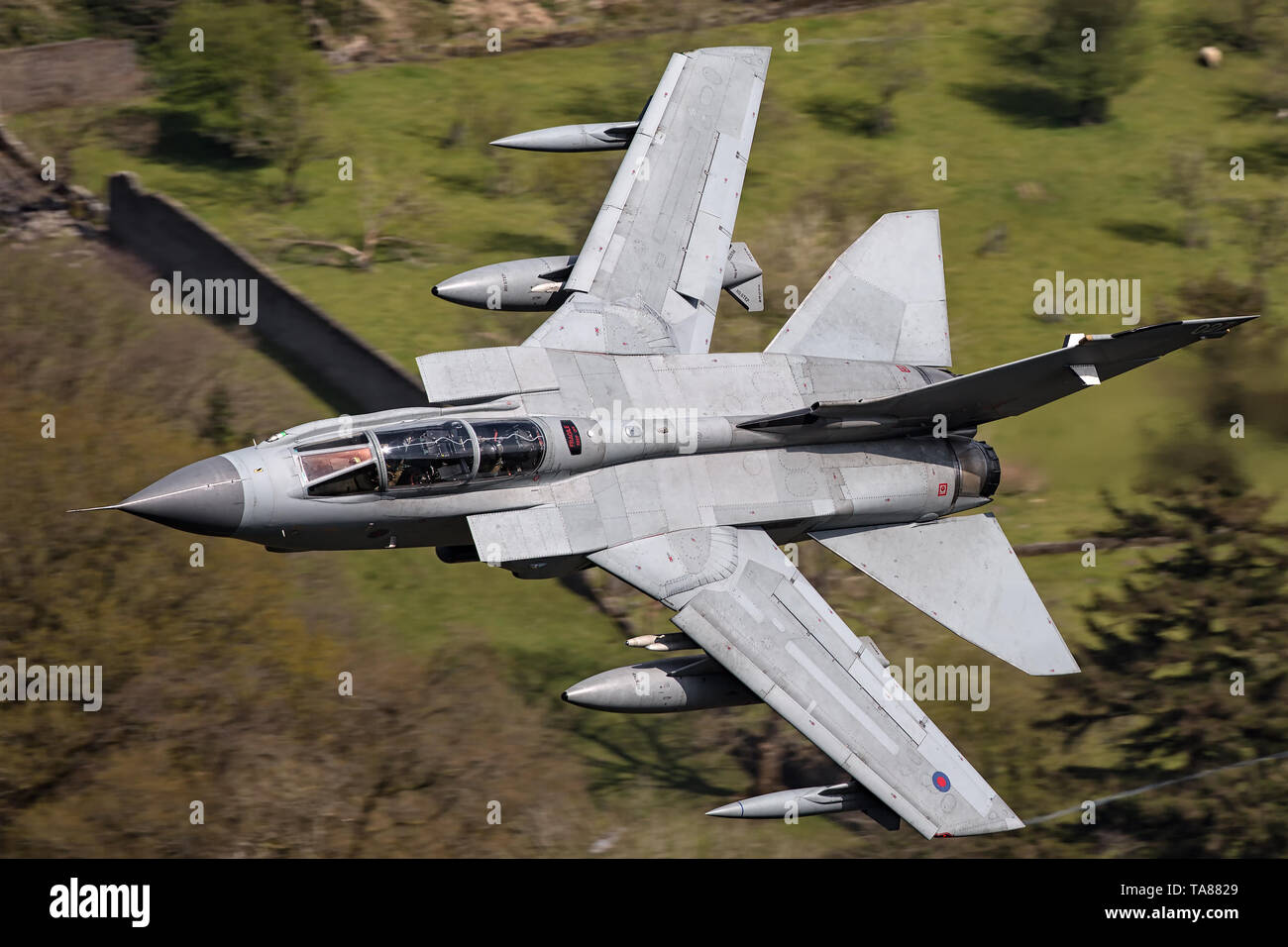 RAF Panavia Tornado GR4 jet flying low level through the Mach Loop, Wales, UK Stock Photo